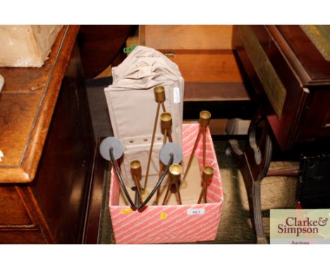 A metal candelabra; another and a shoe organiser