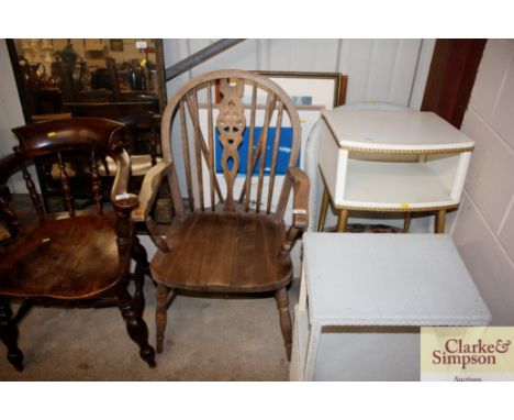 An elm seated stick and wheel back elbow chair