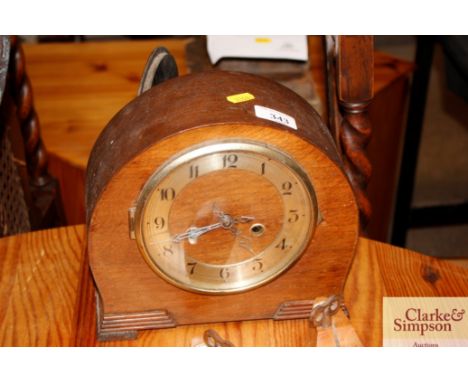A 1930's walnut cased mantle clock