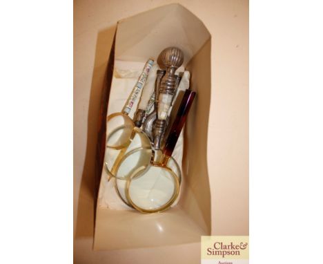 A quantity of magnifying glasses, nutcracker etc.