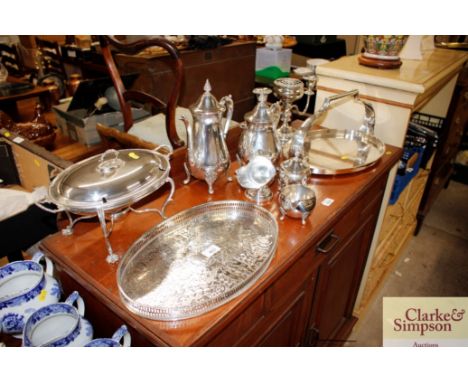 A quantity of various platedware to include a tea set; candelabra; hot dish and a basket