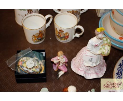 A Royal Worcester porcelain figure "Spring Fair"; a small porcelain "Romeo" figure; and a Halcyon Days enamel decorated clock