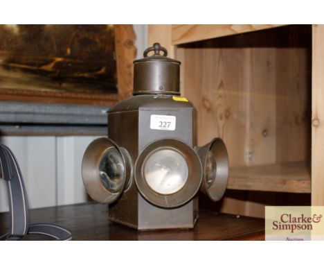 A brass cased three light signal lamp