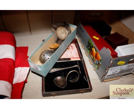 A silver ash tray; various plated spoons; Christening set