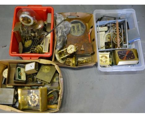 A 19th Century Walnut Mantel Clock (face missing), together with a large collection of clock parts 