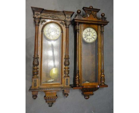 A Victorian Walnut Vienna Wall Clock, the enamel dial with Roman numerals and with weight driven movement, together with anot