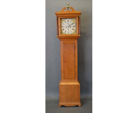 A George III Oak Longcase Clock, the square hood with swan neck pediment and turned pilasters above a rectangular door and co