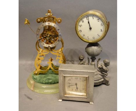 A Tudric Beaten Pewter Clock of square form, together with a 20th century brass skeleton clock and a drum clock 