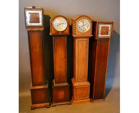 An Early 20th Century Oak Longcase Clock, together with three other similar oak longcase clocks 