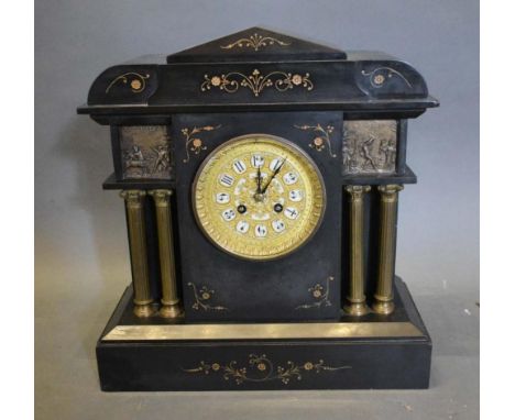 A Victorian Black Slate Mantel Clock, the filigree brass dial with Arabic numerals and two train movement flanked by Corinthi