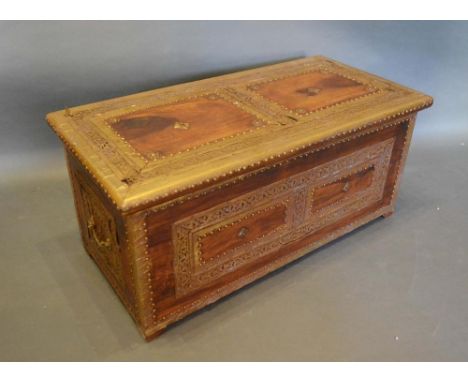 An Eastern Hardwood and Brass Trunk with end handles, 76cm wide, 36cm deep, 33cm high 