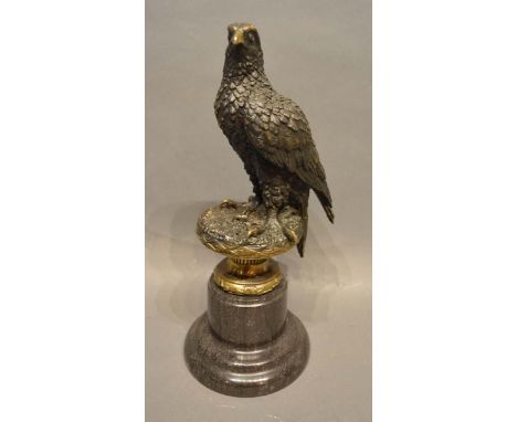 A Patinated Bronze Model in the Form of an Eagle upon a variegated marble socle, 32cm tall 
