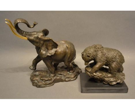 A Patinated Bronze Model in the Form of an Elephant, together with another similar in the form of a bear, 24 and 16cm tall 