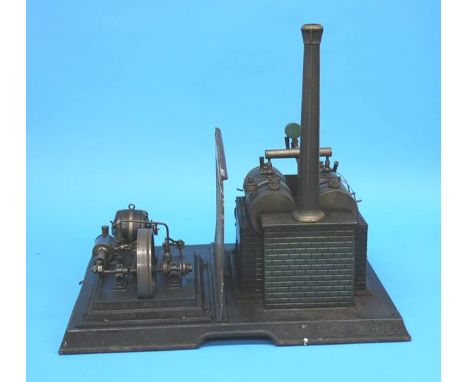 An early 20th Century Marklin Wurttemberg steam engine, with two horizontal boilers, central sliding tin plate divide, a hori
