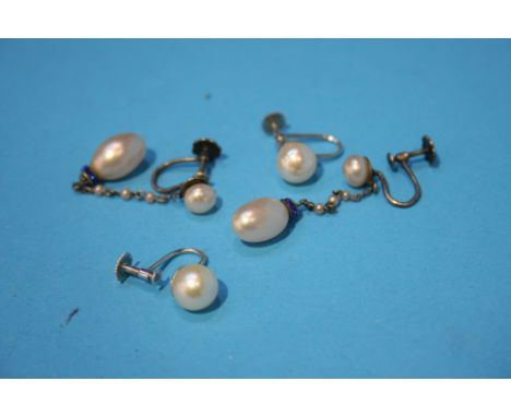 A pair of white gold pearl earrings and another pair of silver pearl earrings