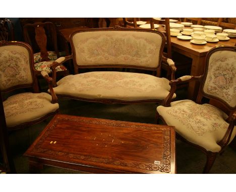 A French style three piece suite; comprising pair of armchairs and two seater sofa