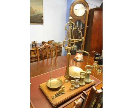 A set of Librasco brass scales with a selection of brass weights
