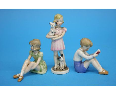 A Goebel figure of a girl holding a dog, GF 83 and two figures of a boy and girl seated