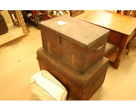 A wooden trunk and a tin trunk