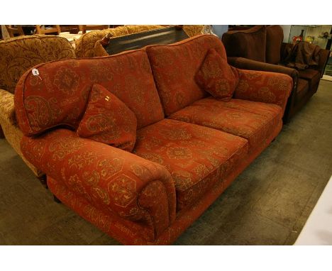 A terracotta two seater sofa