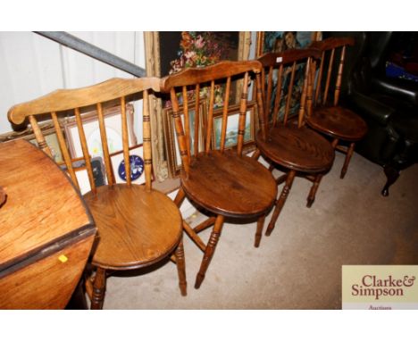 A set of four elm seated stick back dining chairs and an oak gate leg table 
