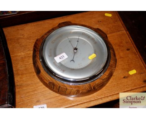 An oak cased barometer