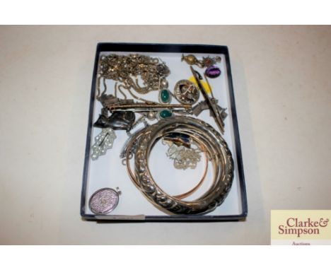 A white metal bangle, bar brooch and various other bangles and bracelets 