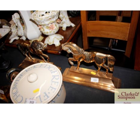 A pair of antique brass mantelpiece horse ornaments 