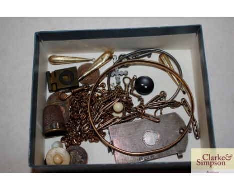 A yellow metal bangle;  a white metal bangle; various ear-rings; a miniature notepad etc.