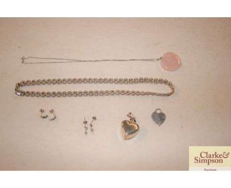 A rose quartz pendant on fine link chain; a white metal necklace; a heart shaped pendant locket etc. 