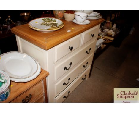 A modern light oak and white painted chest of two short and three long drawers 