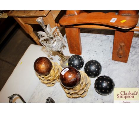 Three decorative studded metal balls; a pair of pottery ornaments and a decorative candle stick etc.