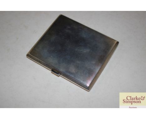 An engine turned silver cigarette case, 142gms 
