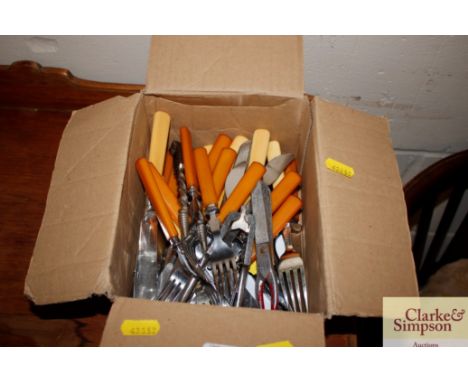 A quantity of various plated cutlery to include fish knives and forks, Bakelite handled cake knives and forks; nutcracker etc