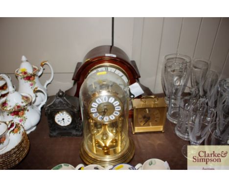 A Howard Miller Westminster chime mantel clock and three other clocks