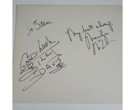 A vintage signed cardboard display featuring the autographs of Marilyn McCoo and Billy Davis Jr., legendary members of the Gr