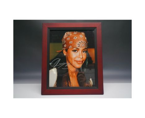 Framed Aaliyah signed 8" x 10" photograph, authenticated by Collector’s Choice, Inc. and accompanied by a Certificate of Auth