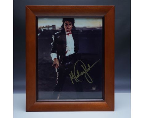 A striking framed photograph of Michael Jackson, featuring the pop icon in his signature style. The image captures Jackson in