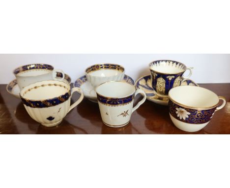 A collection of 19th century English porcelain cups and saucers, all decorated in blue and gold
