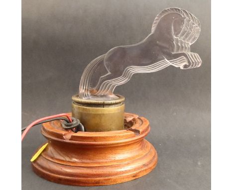 A Lalique Cinq Chevaux glass car mascot, formed as five horses, on wooden base, height 7ins - There is an etched number to th