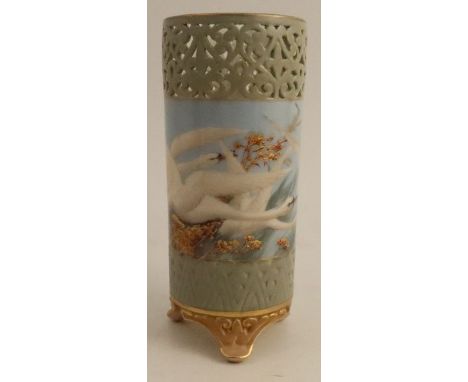 A Royal Worcester cylindrical vase, with open fret work top, painted with swans in flight to a powder blue ground by C.H.C. B