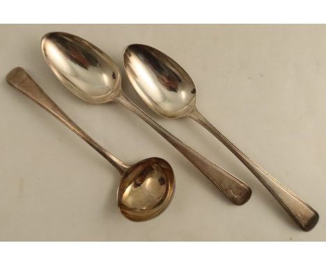 A pair of silver bead edge serving spoons, engraved with a crest, together with matching ladle, London 1783, weight 6oz
