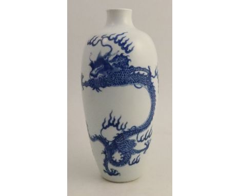 A Chinese Kangxi vase, decorated in blue with a four clawed dragon, height 9.5ins - area to base where old mark may have been