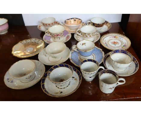 A collection of 19th century English porcelain cups, saucers etc, all decorated in polychrome patterns