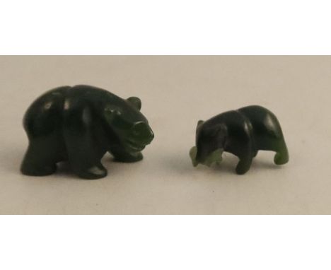 Two jade style miniature models, of bears, one with a fish in its mouth