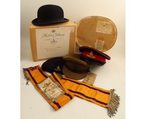 Two Herbert Johnson military caps, with badges, together with a Kangol beret with cap badge, a Locke &amp; Co black bowler ha