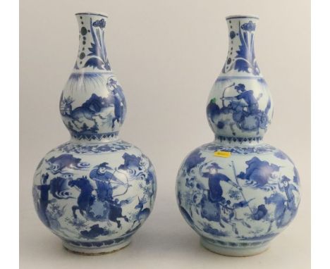 A pair of Chinese Kangxi gourd vases, decorated with figures on horse back hunting, with deer and foliage, height 13.5ins - o