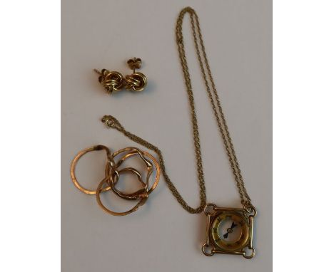A 9ct yellow gold mounted fob compass, suspended on fine link chain, together with a rose gold four-piece puzzle ring and a p