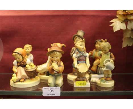 Eight Hummell and Goebel porcelain figures