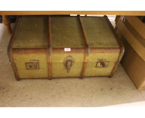 A wooden bound and canvas travelling trunk 